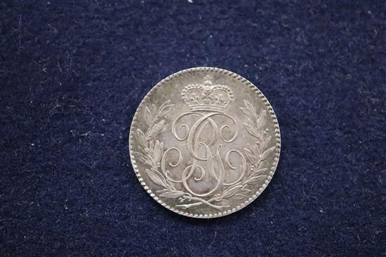 A silver sixpence 1790 Pattern by Droz, GEF and an England and Union of Scotland 1707 silver medal by J. Croker, F